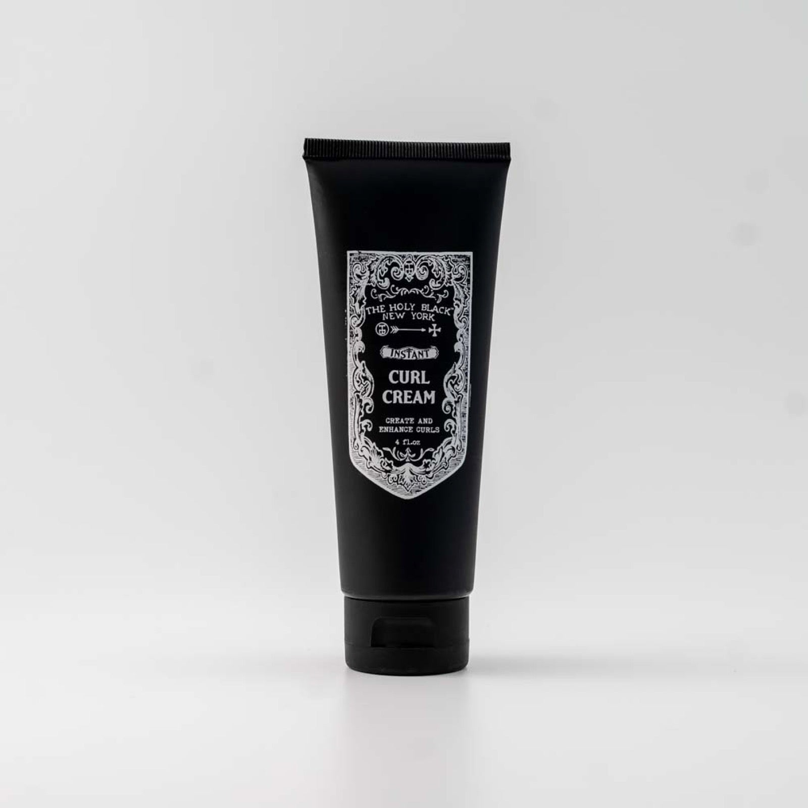 The Holy Black Instant Curl Cream tube