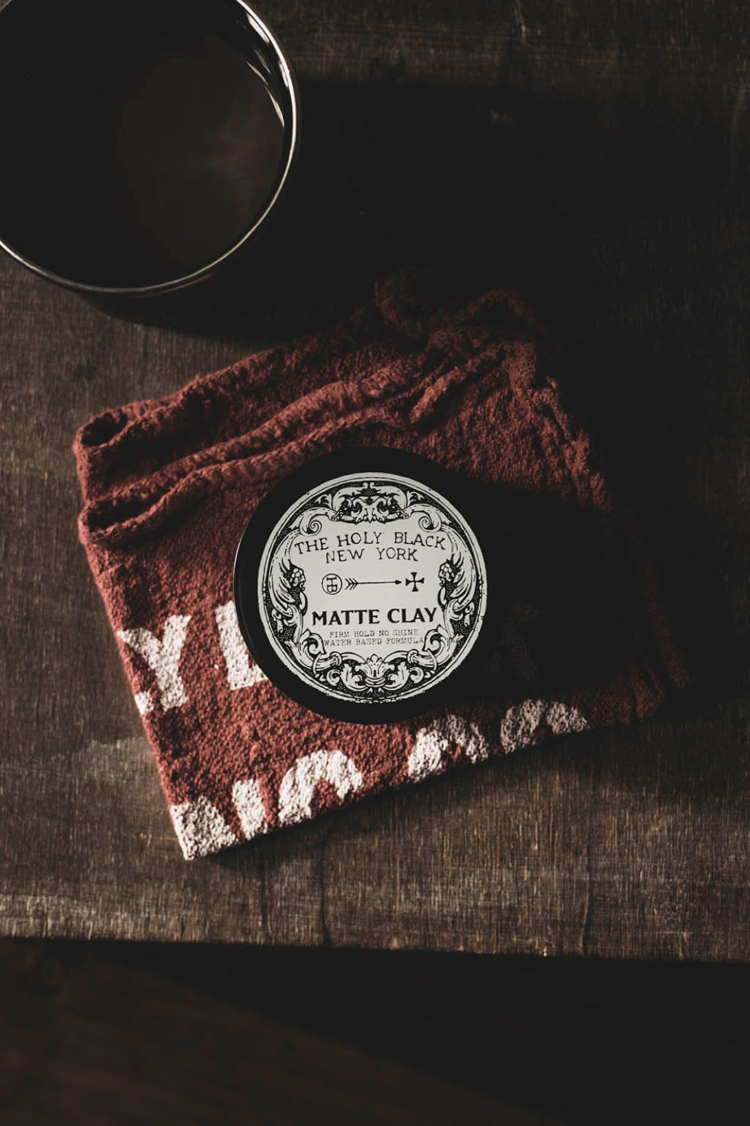 The Holy Black Matte Clay Hair Pomade jar
