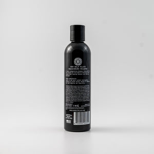 The Holy Black Thickening Shampoo bottle detail