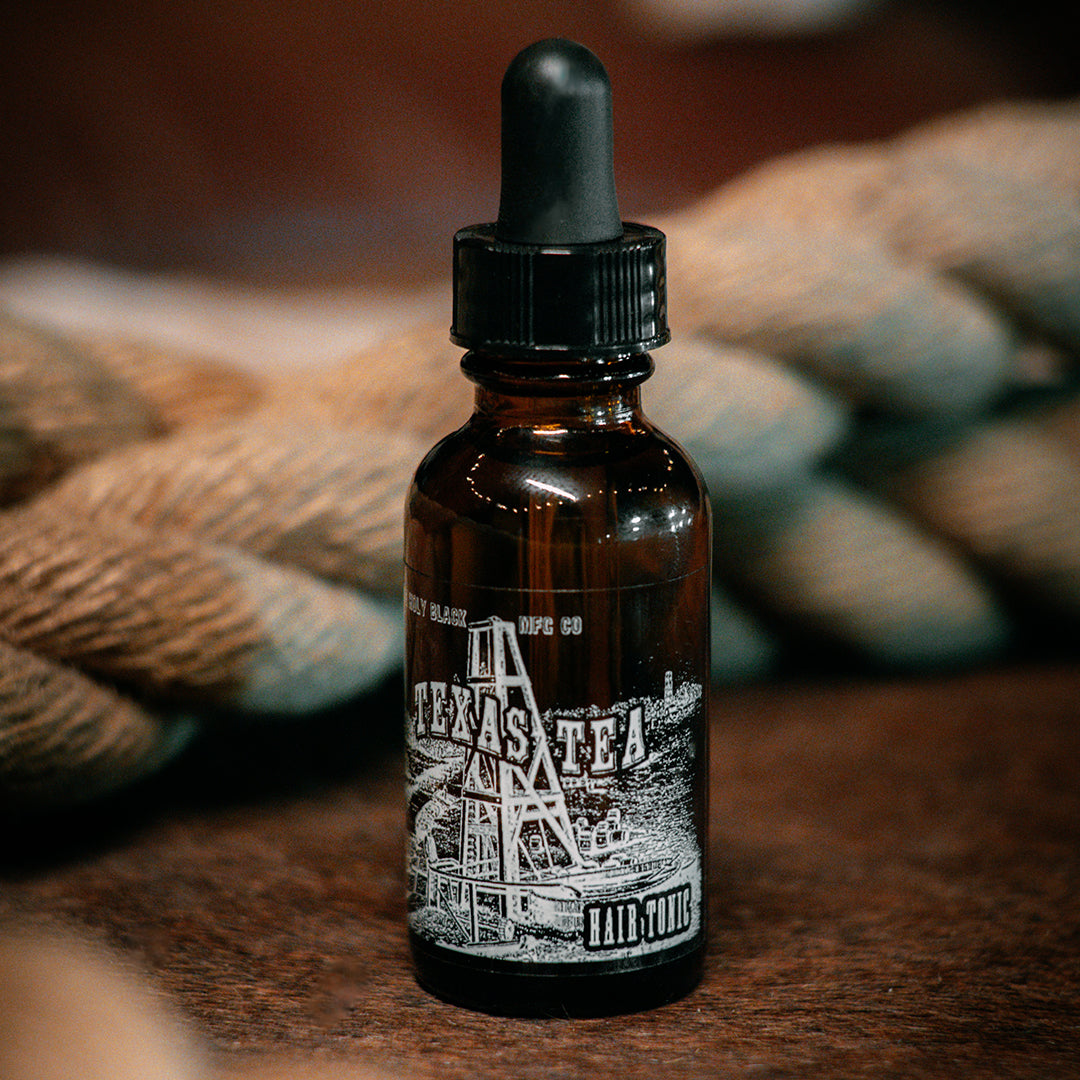 The Holy Black Secret Stash Oil Hair Tonic — lightweight hair oil for shine and conditioning