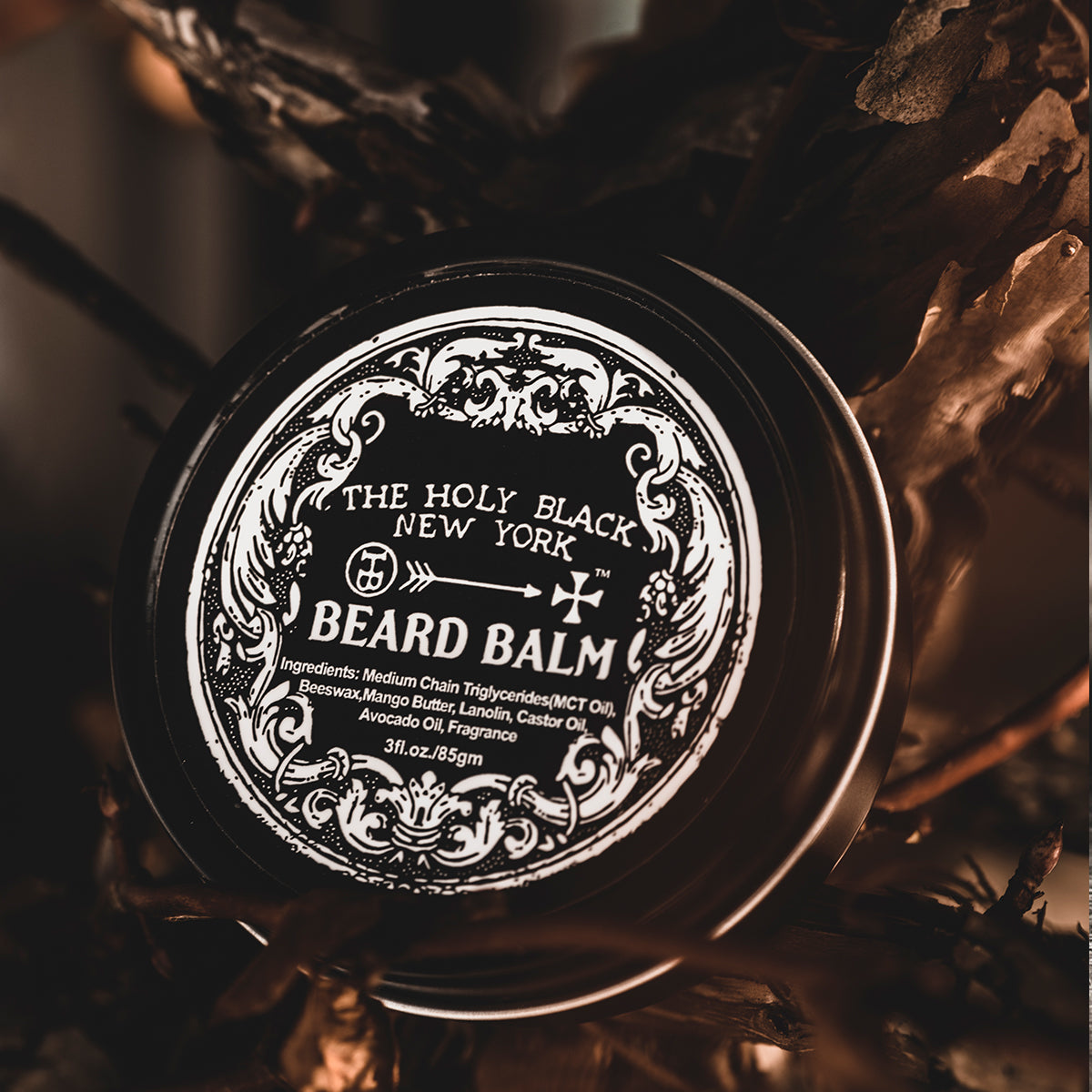 The Holy Black Beard Balm jar detail — ornate label on dark surface