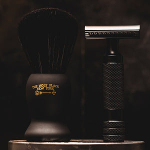 The Holy Black True Black Shave Brush — men's synthetic shave brush — in use