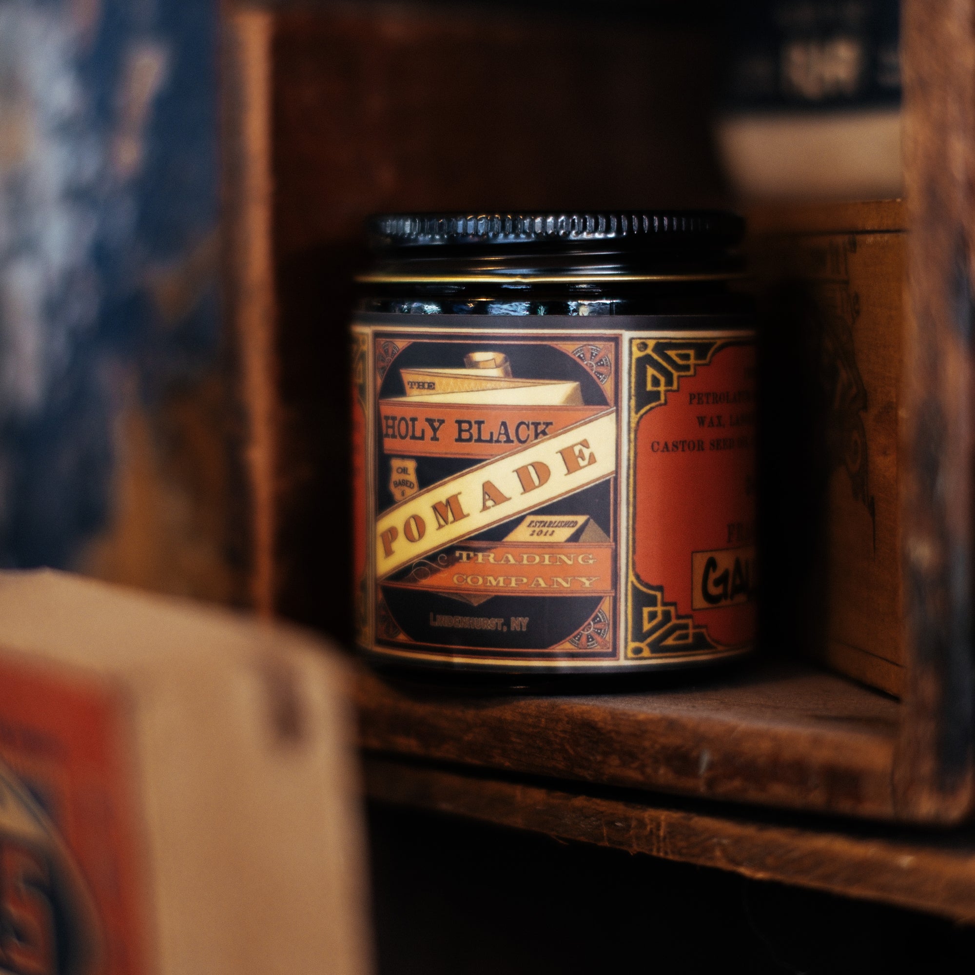 The Holy Black Secret Stash Grease Pomade — men's grooming product — lifestyle shot