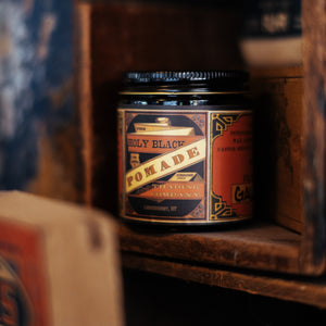 The Holy Black Secret Stash Grease Pomade — men's grooming product — lifestyle shot