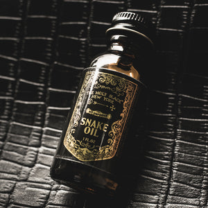 The Holy Black Snake Oil bottle detail — beard oil for men