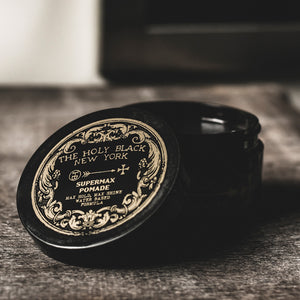 The Holy Black Supermax Pomade jar detail — ornate label