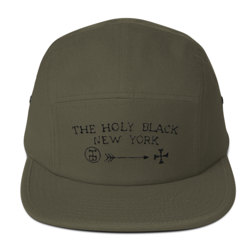 The Holy Black Five Panel Classic — men's grooming product — in use