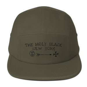 The Holy Black Five Panel Classic — men's grooming product — in use