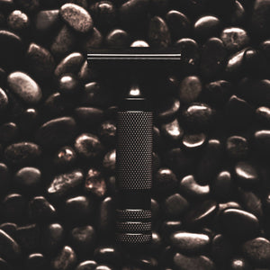 The Holy Black SR-71 Guard Bar razor detail — textured handle safety razor