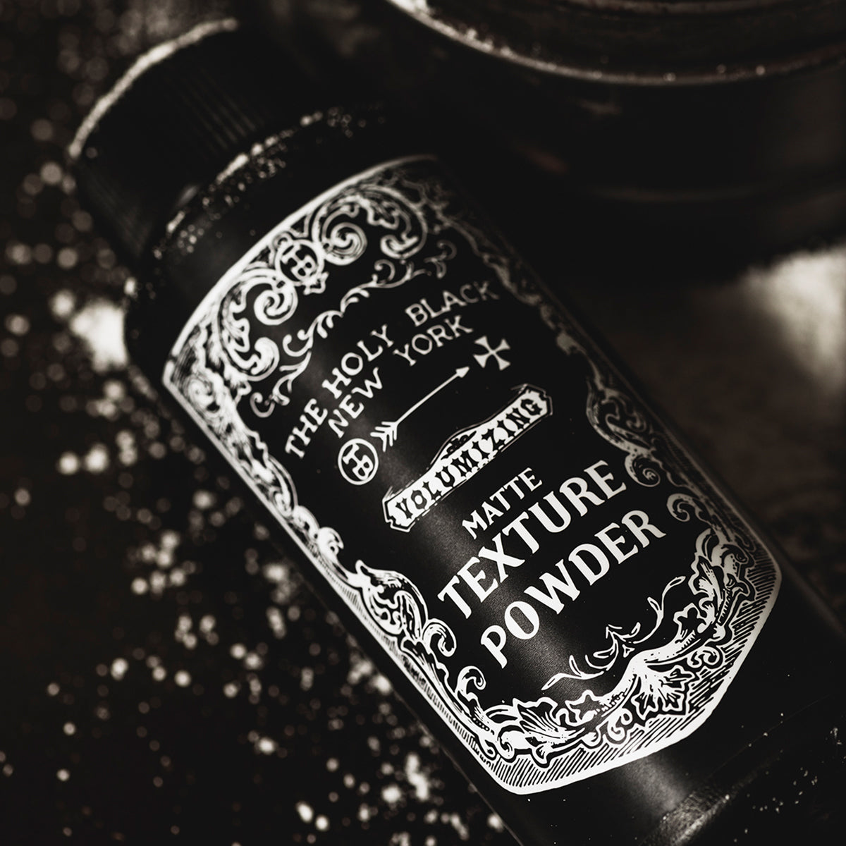 The Holy Black Matte Texture Powder bottle detail